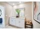 Bright bathroom featuring double vanity, granite countertops, and a large mirror, offering a clean and modern design at 13490 Tropical Breeze Way, Hudson, FL 34669