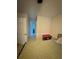 Well-lit bedroom with tile floors featuring a glimpse into an en-suite bathroom at 1407 College Park Ln, Tampa, FL 33612