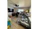 Functional bedroom with a bunk bed, desk, and gaming setup at 1407 College Park Ln, Tampa, FL 33612