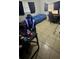 Functional bedroom with a bed, desk, and gaming setup at 1407 College Park Ln, Tampa, FL 33612