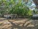 Wide backyard with a shed, play structure and a chicken coop, perfect for Gathering activities and outdoor living at 14350 11Th St, Dade City, FL 33523