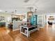 Bright dining area features a large table, stylish lighting, and kitchen access at 14350 11Th St, Dade City, FL 33523