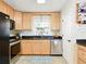 Well-lit kitchen with stainless steel appliances and ample counter space at 14350 11Th St, Dade City, FL 33523