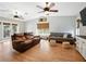 Comfortable living room features wood floors, cozy seating, and natural lighting at 14350 11Th St, Dade City, FL 33523