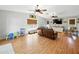 Inviting living room with vaulted ceilings, wood floors, and natural light at 14350 11Th St, Dade City, FL 33523