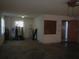 Spacious garage with water heater, utility tanks, and access door at 14614 Lake Magdalene Cir, Tampa, FL 33613