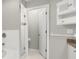 Modern bathroom with tiled shower, glass door, and white cabinets with granite countertops at 1640 Lullwater Ln, Lutz, FL 33549