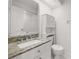 Bathroom features a sink with granite countertop and toilet at 1640 Lullwater Ln, Lutz, FL 33549