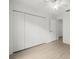 Bedroom featuring hardwood floors, neutral walls, and closet at 1640 Lullwater Ln, Lutz, FL 33549