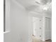 Neutral bedroom with ceiling fan and adjoining bathroom at 1640 Lullwater Ln, Lutz, FL 33549