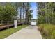 Picturesque community boat ramp and dock access with mature trees along a tranquil lake at 1640 Lullwater Ln, Lutz, FL 33549