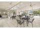 Clubhouse featuring seating, tile floors, and ceiling fans at 1640 Lullwater Ln, Lutz, FL 33549