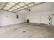 Garage with high ceilings, water heater, and concrete floor at 1640 Lullwater Ln, Lutz, FL 33549