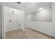 Bright laundry room with modern fixtures, tiled floor, and ample storage space at 1640 Lullwater Ln, Lutz, FL 33549