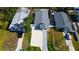 Aerial shot showcases the house with a large driveway surrounded by well-kept lawns at 1820 Mississippi Ave Ne, St Petersburg, FL 33703