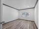 Sunlit bedroom with wood-look floors, neutral walls, and modern trim, creating a welcoming atmosphere at 1820 Mississippi Ave Ne, St Petersburg, FL 33703
