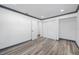 Bedroom with wood-look flooring, neutral paint, and closet at 1820 Mississippi Ave Ne, St Petersburg, FL 33703