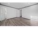 Spacious bedroom showcasing wood-look flooring and neutral paint at 1820 Mississippi Ave Ne, St Petersburg, FL 33703