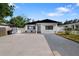 Charming single Gathering home with a beautifully landscaped yard and a long, spacious driveway at 1820 Mississippi Ave Ne, St Petersburg, FL 33703