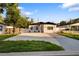 Charming single Gathering home with a beautifully landscaped yard and a long, spacious driveway at 1820 Mississippi Ave Ne, St Petersburg, FL 33703