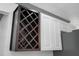 Close-up of kitchen cabinets with wine rack insert at 1820 Mississippi Ave Ne, St Petersburg, FL 33703