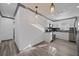Well-lit kitchen featuring white cabinets, stainless steel appliances, and stylish pendant lighting at 1820 Mississippi Ave Ne, St Petersburg, FL 33703