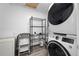 Functional laundry room featuring modern washer/dryer unit and ample storage space at 1820 Mississippi Ave Ne, St Petersburg, FL 33703