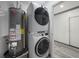 Laundry area features a stackable washer and dryer, and hot water heater at 1820 Mississippi Ave Ne, St Petersburg, FL 33703