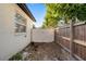 A view of the yard between fences showing the new privacy fence with a double gate at 1820 Mississippi Ave Ne, St Petersburg, FL 33703