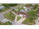 Beautiful home with lush landscaping, a large driveway, and an attached three-car garage at 1915 Belleair Rd, Clearwater, FL 33764