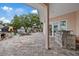 Spacious backyard with covered patio, outdoor kitchen, and ample room for entertaining at 1915 Belleair Rd, Clearwater, FL 33764