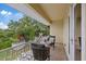 Balcony with a seating area, a decorative metal railing, and neighborhood views at 1915 Belleair Rd, Clearwater, FL 33764