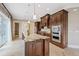 Gourmet kitchen with custom wood cabinetry, stainless steel appliances, and granite countertops at 1915 Belleair Rd, Clearwater, FL 33764