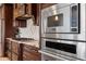 This kitchen boasts stainless steel Viking appliances, granite countertops, and stylish dark wood cabinetry at 1915 Belleair Rd, Clearwater, FL 33764