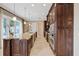 Gourmet kitchen with stainless steel appliances, granite countertops, and custom cabinetry at 1915 Belleair Rd, Clearwater, FL 33764