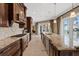 Expansive kitchen featuring stainless steel appliances, granite counters, and a large island at 1915 Belleair Rd, Clearwater, FL 33764