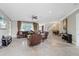 Spacious living room with high ceilings, leather furniture, and a staircase to the upper level at 1915 Belleair Rd, Clearwater, FL 33764