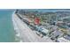 Breathtaking aerial view of the beautiful beachside home, showcasing the stunning coastline and surrounding neighborhood at 2800 Gulf Blvd Unit # 1A, Belleair Beach, FL 33786
