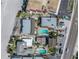 Aerial view of property featuring a pool, lush greenery, and a convenient parking area, offering a relaxing escape at 2800 Gulf Blvd Unit # 1A, Belleair Beach, FL 33786