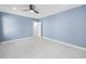 Spacious bedroom with plenty of natural light and a ceiling fan at 2800 Gulf Blvd Unit # 1A, Belleair Beach, FL 33786