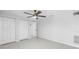 Minimalist bedroom with large windows and neutral colors and flooring at 2800 Gulf Blvd Unit # 1A, Belleair Beach, FL 33786