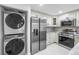 Kitchen featuring stainless steel appliances, modern appliances, and bright lighting at 2800 Gulf Blvd Unit # 1A, Belleair Beach, FL 33786