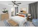 Comfortable main bedroom with calming colors, decorative lighting and updated flooring at 2800 Gulf Blvd Unit # 1A, Belleair Beach, FL 33786
