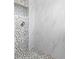 Modern shower featuring mosaic tiles, rainfall shower head, and sleek fixtures at 2800 Gulf Blvd Unit # 1A, Belleair Beach, FL 33786