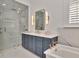 Modern bathroom featuring a glass-enclosed shower, soaking tub, and sleek fixtures at 29540 Chapel Park Dr, Wesley Chapel, FL 33543