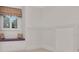 Sitting area with window bench, paneled walls, and natural light at 29540 Chapel Park Dr, Wesley Chapel, FL 33543