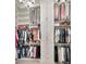 Spacious walk-in closet with custom shelving and hanging storage for organization at 29540 Chapel Park Dr, Wesley Chapel, FL 33543