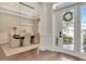 Inviting foyer featuring a decorative wreath on the front door and a glimpse into the adjacent dining area at 29540 Chapel Park Dr, Wesley Chapel, FL 33543