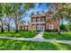 Beautiful two-story brick home with lush landscaping and a welcoming front entrance at 29540 Chapel Park Dr, Wesley Chapel, FL 33543