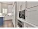 This modern kitchen features stainless steel appliances and lots of cabinets for storage at 29540 Chapel Park Dr, Wesley Chapel, FL 33543